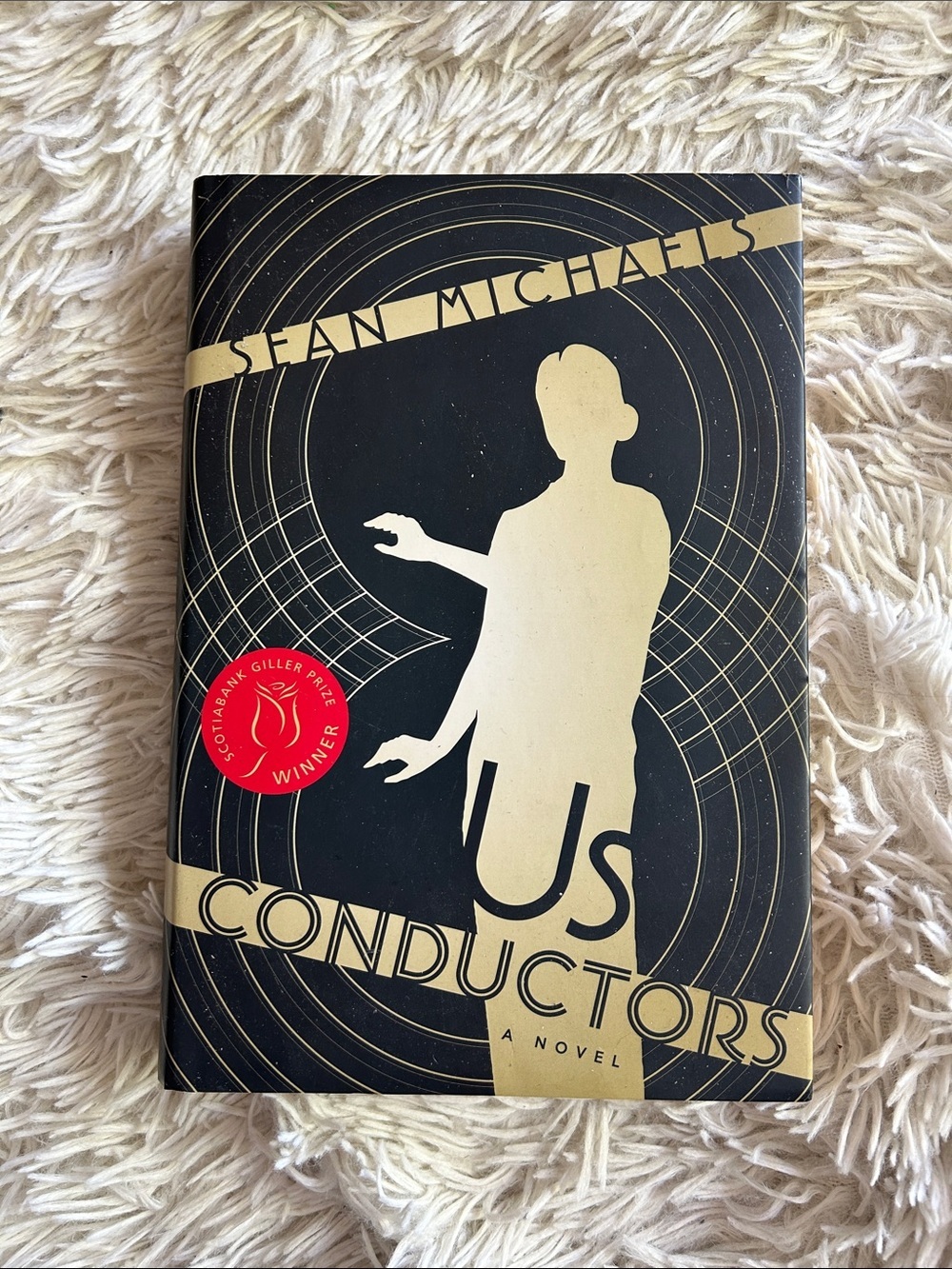 Us Conductors by Sean Michaels - Black & Gold Hardcover, Giller prize